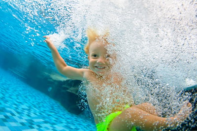 child-swimming-underwater